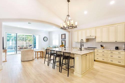 Naples Park House | Imola Vacation Rental - Remodeled Pool Home Minutes from Vanderbilt Beach! Family-Friendly Retreat with 4 BR 4 BA and Private Screened Pool!