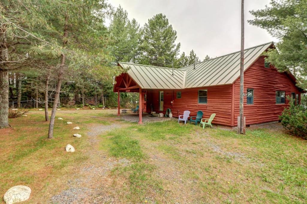 Greenville Junction House | Lakefront Home with Private Dock, Pebble Beach & Enclosed Porch - Dogs Welcome