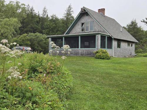 Owls Head House | Peaceful coastal cabin with screened porch, water view of the cove, dog-friendly