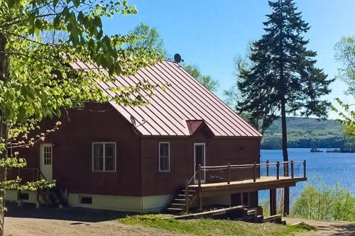 Greenville Junction House | Spectacular lakefront home with dock, firepit, & vaulted ceilings - dog-friendly
