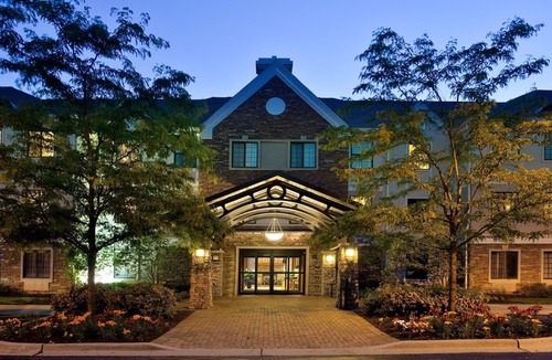 Half Day Condo | Business District Suite with Pool Access, Free Breakfast + Weekday Shuttle