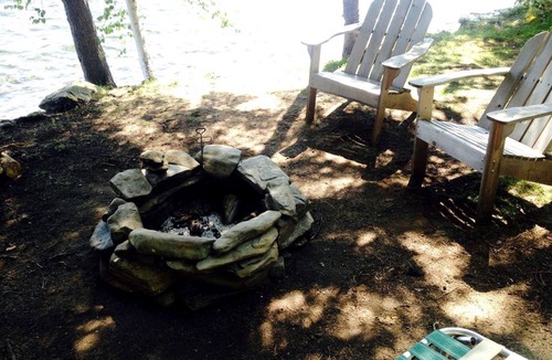 Brownville Cabin | Charming Lakefront Cabin Rental with a Fire Pit near Brownville, Maine