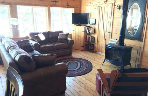 Brownville House | Charming Lakefront Cabin Rental with a Fire Pit near Brownville, Maine