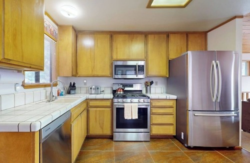 Arrowhead Villas Cabin | Cheery cabin with gas grill, patio, deck, outdoor space, & near lake