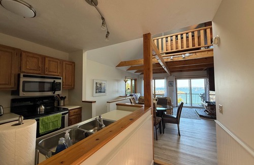 Southwest Harbor Condo | Enjoy the stunning ocean view from the hot tub at Port!