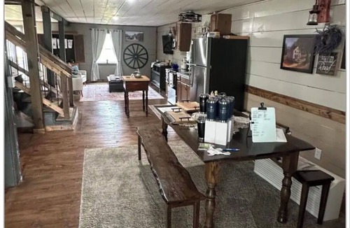 Mammoth Spring House | Float the river Historic 1916 Saddle Store with covered porchMammoth Spring Ar