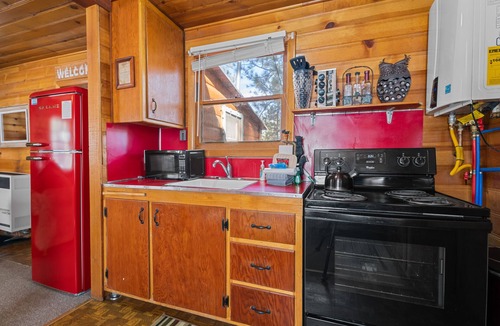 The Village House | Highland Hideaway - Walk to Lake & Village, Pet Friendly, Fenced Yard