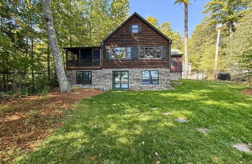 Rome House | Inviting Lakeside Home with direct dock access, patio seating, and gas fireplace
