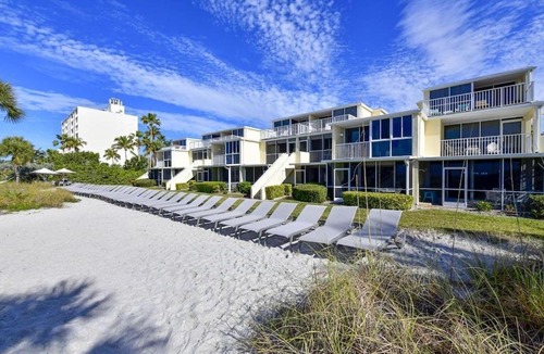 Longboat Key Apartment | LaPlaya 201C Breathtaking Gulf panorama from this corner end unit with a private stairway to the beach