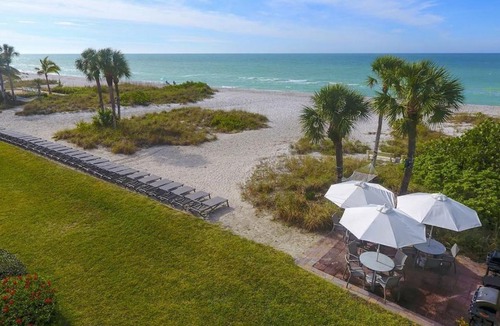Longboat Key Apartment | LaPlaya 201C Breathtaking Gulf panorama from this corner end unit with a private stairway to the beach