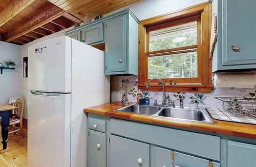Warren House | Loon's Cry on South Pond- Sunny, lakefront home with private dock, great deck & firepit