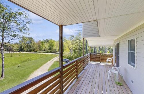 Bayside House | Modern farmhouse with deck, firepit, & balcony