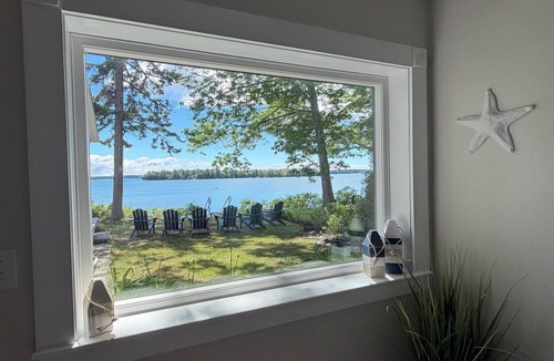 Freeport House | Oceanfront home with private steps to the sea + kayaks