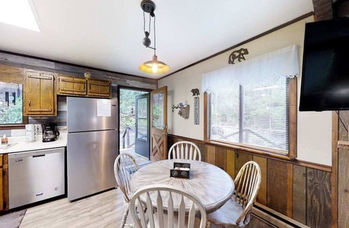 Murphy House | Secluded home with deck, firepit, sunroom, gas fireplace, & W/D