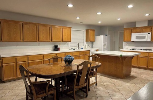 Eastvale House | Set beside a golf course in Eastvale, this spacious 3,099 sq. ft. furnished home offers four bedrooms, a private non-heated pool, dedicated workspace, and inviting indoor and outdoor living areas. Designed for 30+ day stays.