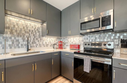 North Trail Condo | The Strand 304 - Luxury Waterfront Bay Views - Heated Pool & Spa - Near Downtown
