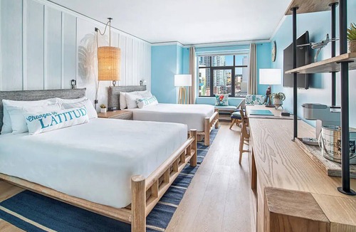 East Village Hotel | Unwind in a Tropical-Themed Room with Festive Vibes