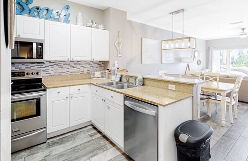 Frangista Beach Condo | Updated, beachside condo with dual suites, balcony & pool - walkable locale