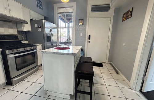 Logan Square House | Walkup Greystone steps to Logan Square restaurants, shopping bars and nightlife.