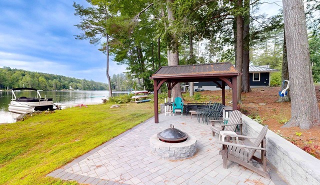 Charming apartment with waterfront access, modern comforts, and lakeside firepit