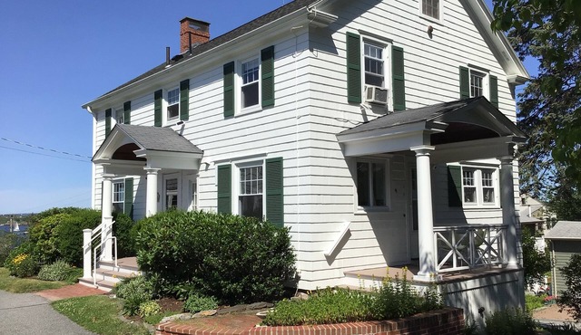 Distinguished classic coastal home overlooks Casco Bay and Maine’s rocky shore!