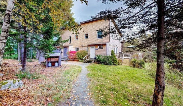 Dog-friendly ocean-view home with grill, wood stove, deck, washer/dryer, & AC