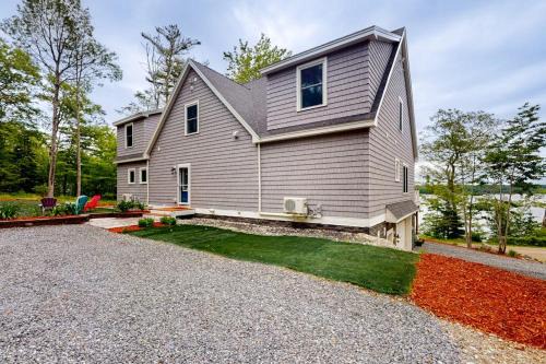 Luxurious waterfront home with deck, firepit, hot tub, fireplace, & pool table