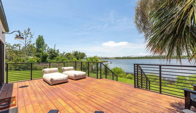 Modern oasis with private pool, dock and water views