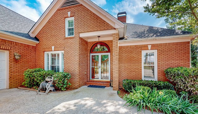 Multi-level home with an in-home theater, fireplace, & enclosed yard - dogs ok