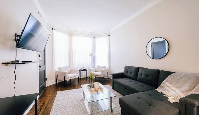 Spacious 3-bedroom retreat in West Logan with modern amenities, perfect for families looking to relax and explore vibrant Logan Square.