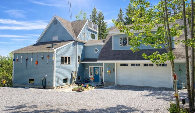 Spacious 5 bedroom home just a short walk to local beach and ocean views from the upper decks!