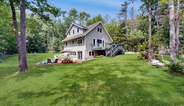 Sunny, lakefront home on South Pond with private dock, great deck & firepit