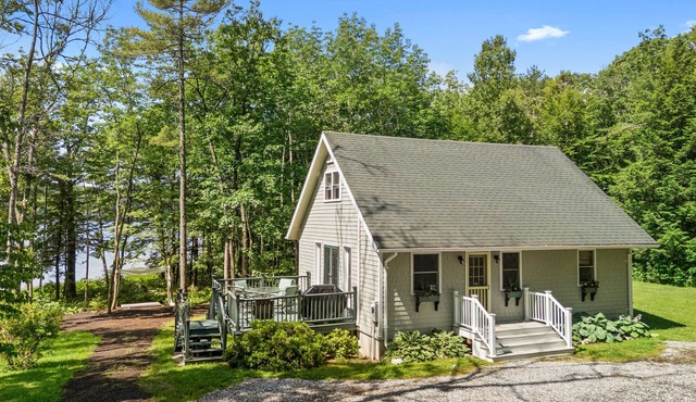 Sunny, lakefront home on South Pond with private dock, great deck & firepit