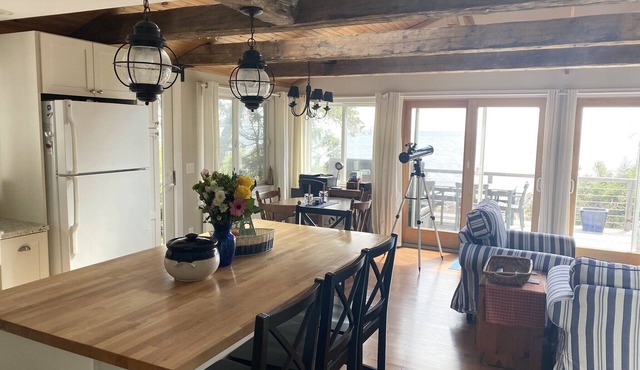 Take in the breathtaking views at our popular oceanside cottage with large deck.