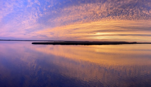 Waterfront campsite, a serene oasis for nature lovers and fishing enthusiasts!