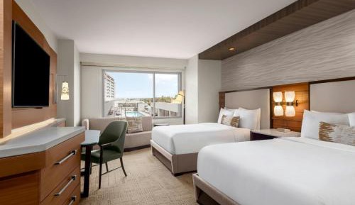 Deluxe Queen Room with Two Queen Beds and Pool View